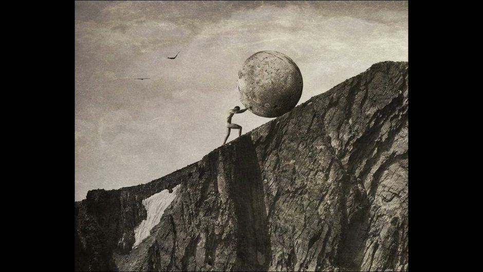 Человек толкает камень